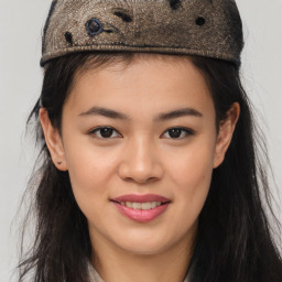 Joyful asian young-adult female with long  brown hair and brown eyes