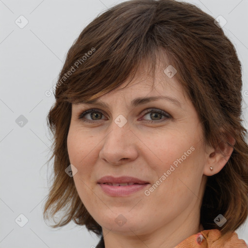 Joyful white adult female with medium  brown hair and brown eyes