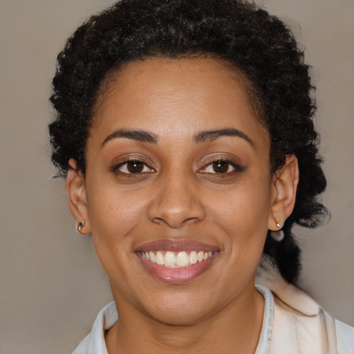 Joyful latino young-adult female with short  brown hair and brown eyes