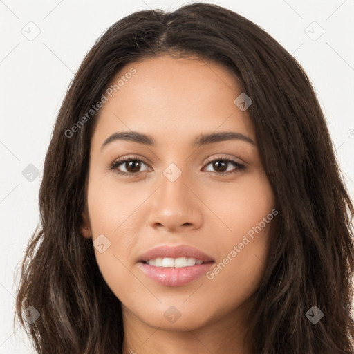 Joyful latino young-adult female with long  brown hair and brown eyes