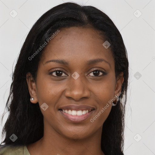 Joyful black young-adult female with long  brown hair and brown eyes