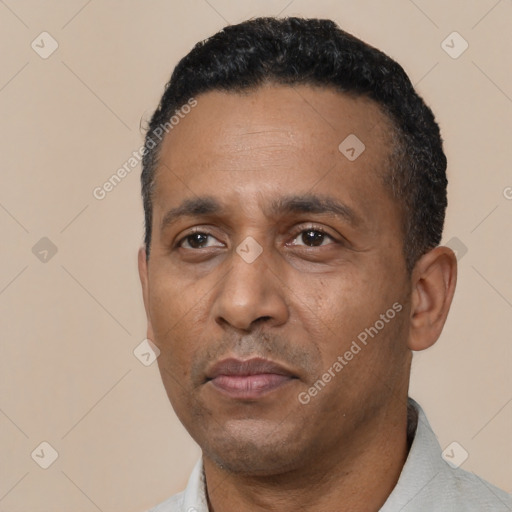 Neutral black adult male with short  black hair and brown eyes
