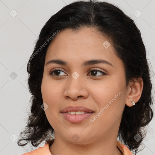 Joyful latino young-adult female with medium  brown hair and brown eyes