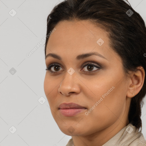 Joyful latino young-adult female with medium  brown hair and brown eyes