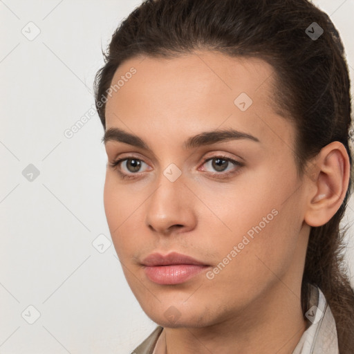 Neutral white young-adult female with long  brown hair and brown eyes