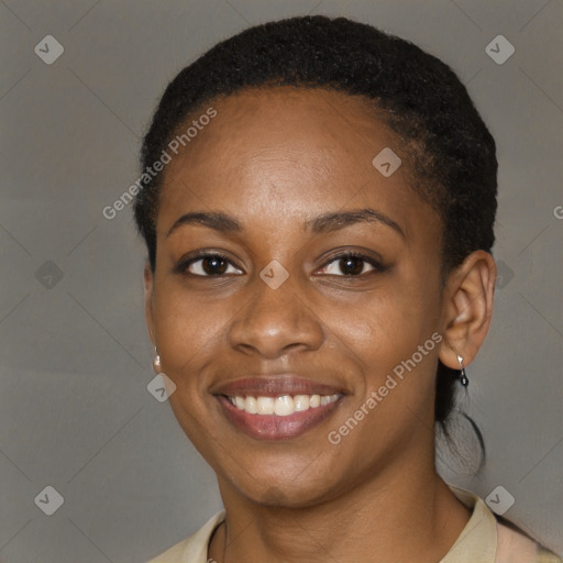 Joyful black young-adult female with short  brown hair and brown eyes