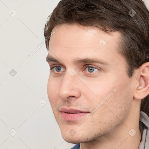 Neutral white young-adult male with short  brown hair and grey eyes