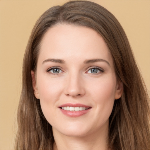 Joyful white young-adult female with long  brown hair and grey eyes