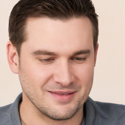 Joyful white young-adult male with short  brown hair and brown eyes