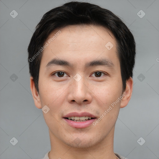 Joyful asian young-adult male with short  brown hair and brown eyes