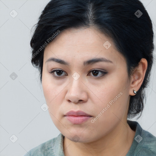 Joyful asian young-adult female with medium  black hair and brown eyes