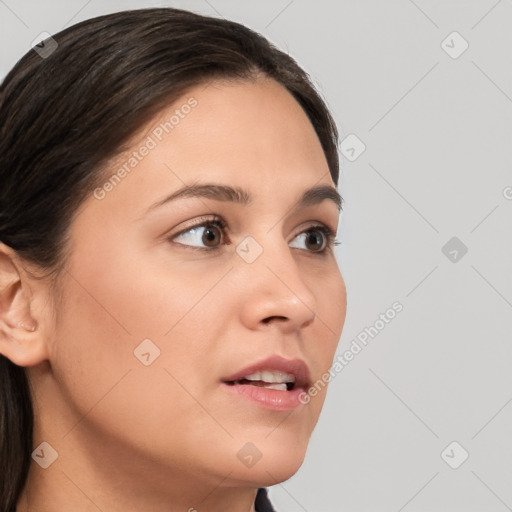 Neutral white young-adult female with long  brown hair and brown eyes