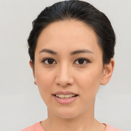 Joyful asian young-adult female with short  brown hair and brown eyes