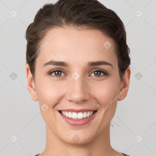 Joyful white young-adult female with short  brown hair and brown eyes