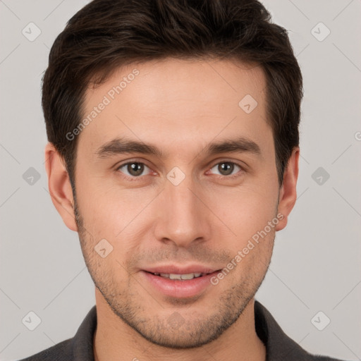 Joyful white young-adult male with short  brown hair and brown eyes