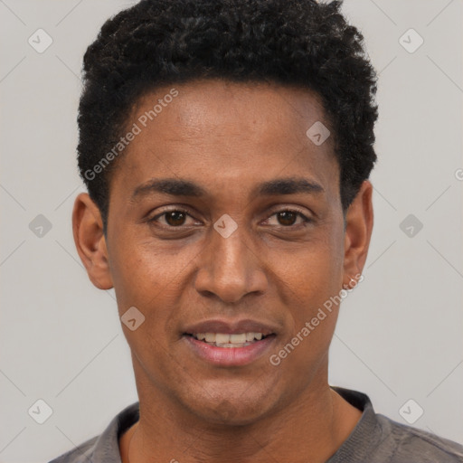 Joyful black young-adult male with short  black hair and brown eyes