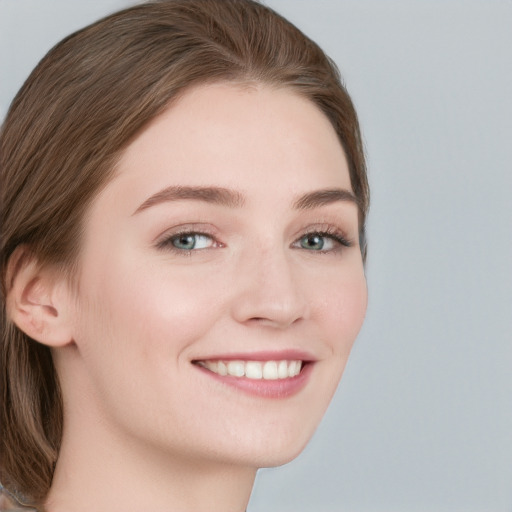 Joyful white young-adult female with long  brown hair and blue eyes