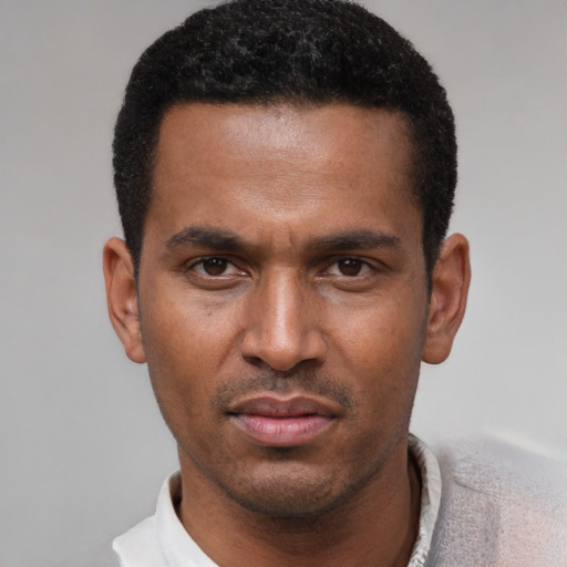 Neutral latino young-adult male with short  black hair and brown eyes