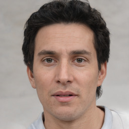 Neutral white adult male with short  black hair and brown eyes