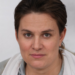 Joyful white adult female with short  brown hair and brown eyes