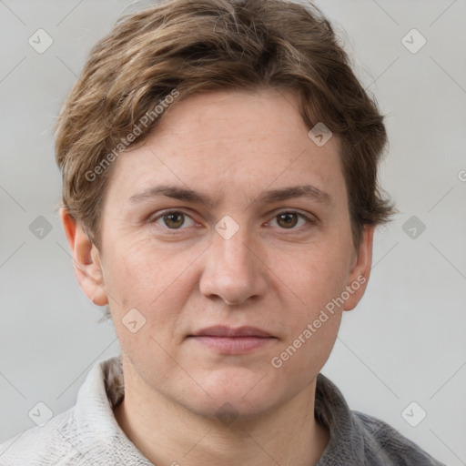 Joyful white adult female with short  brown hair and grey eyes