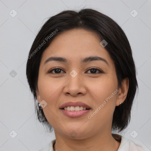 Joyful asian young-adult female with medium  black hair and brown eyes