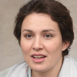 Joyful white adult female with medium  brown hair and brown eyes