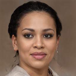 Joyful latino young-adult female with short  brown hair and brown eyes