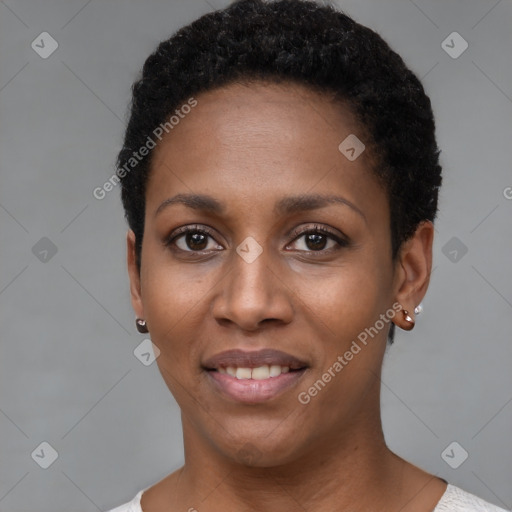 Joyful black young-adult female with short  black hair and brown eyes