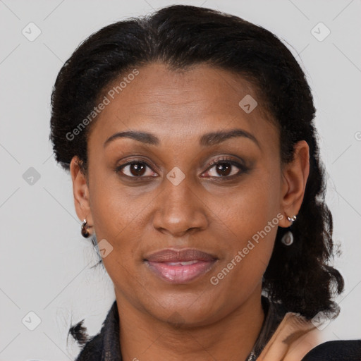 Joyful latino adult female with medium  brown hair and brown eyes