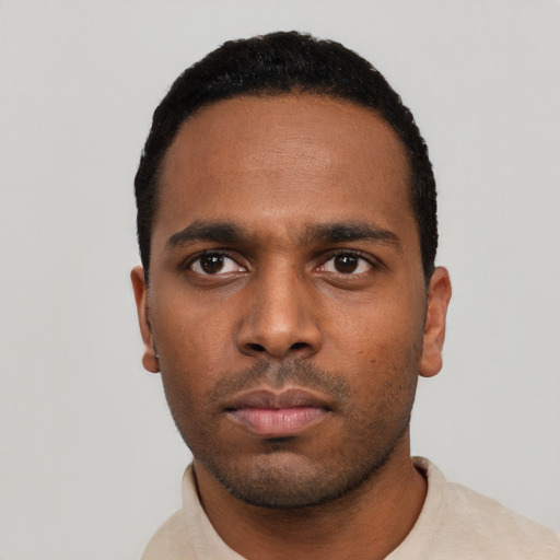 Neutral black young-adult male with short  black hair and brown eyes