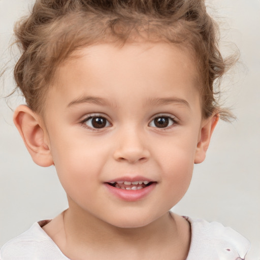 Joyful white child female with short  brown hair and brown eyes