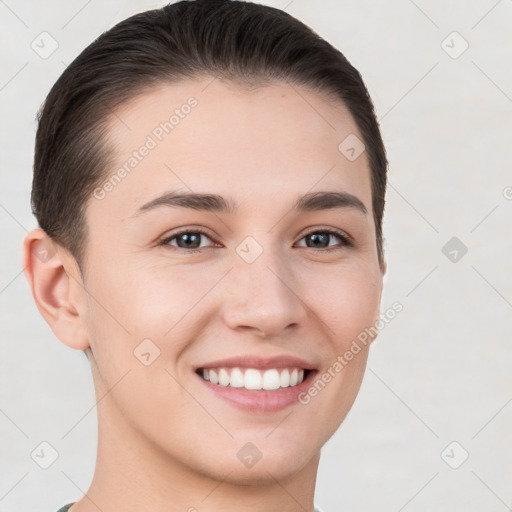 Joyful white young-adult female with short  brown hair and brown eyes