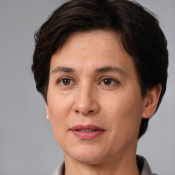 Joyful white adult female with short  brown hair and brown eyes