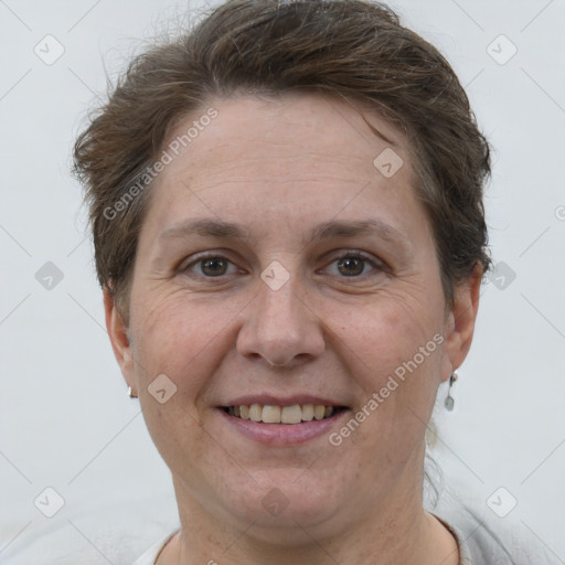 Joyful white adult female with short  brown hair and brown eyes