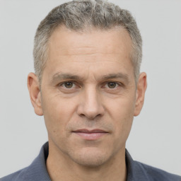 Neutral white middle-aged male with short  brown hair and brown eyes