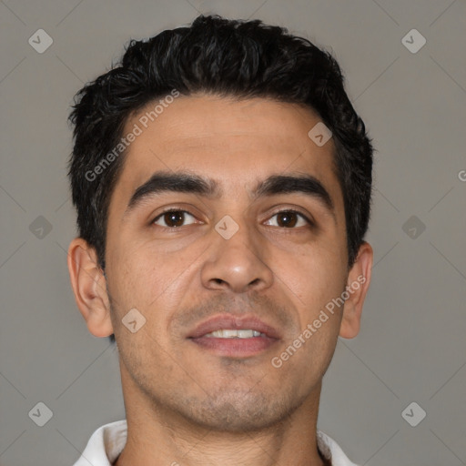 Joyful latino young-adult male with short  black hair and brown eyes