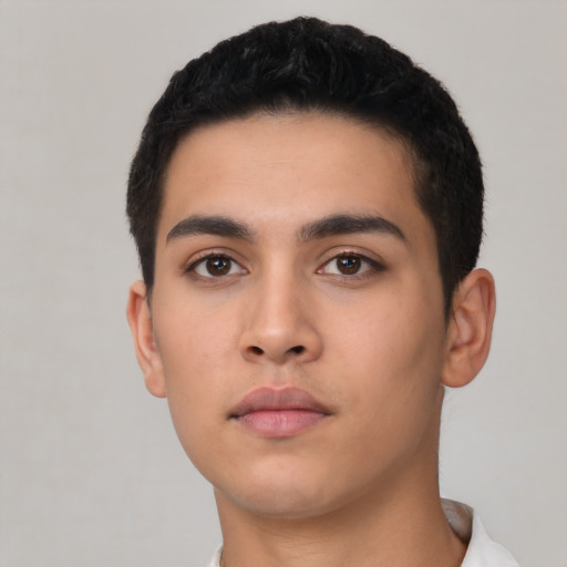 Neutral latino young-adult male with short  black hair and brown eyes