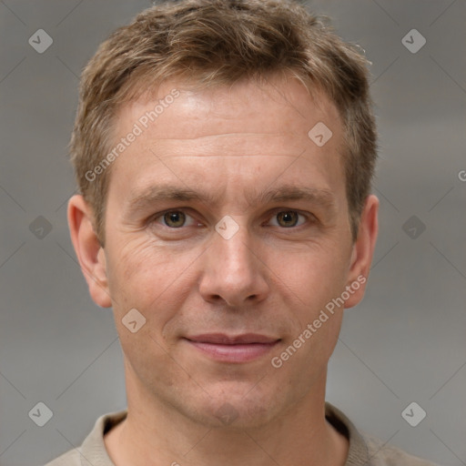 Joyful white adult male with short  brown hair and grey eyes