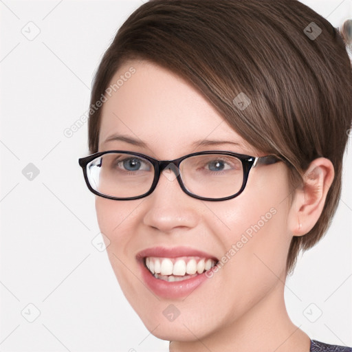 Joyful white young-adult female with medium  brown hair and green eyes