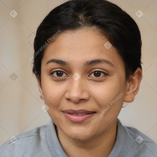 Joyful latino young-adult female with short  brown hair and brown eyes