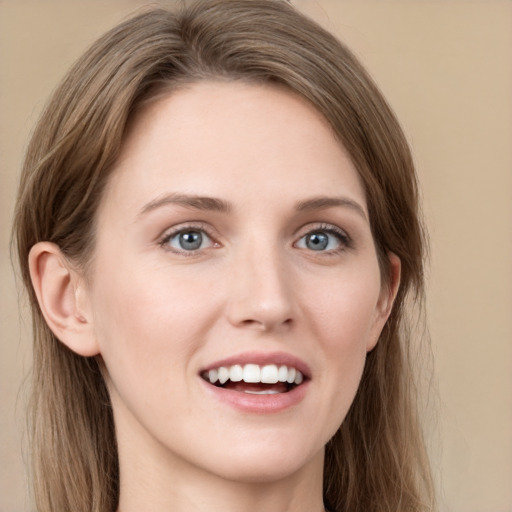 Joyful white young-adult female with long  brown hair and grey eyes