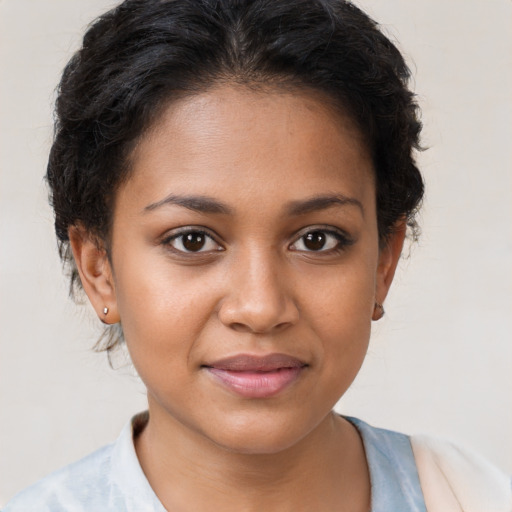 Joyful latino young-adult female with short  brown hair and brown eyes