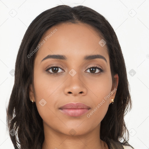 Joyful latino young-adult female with long  brown hair and brown eyes