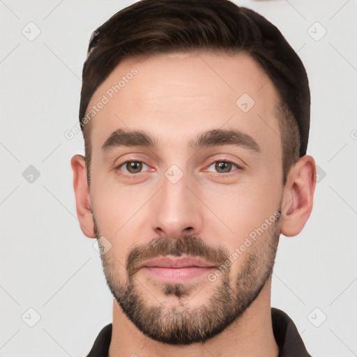 Joyful white young-adult male with short  brown hair and brown eyes