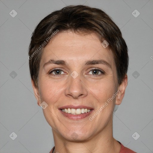 Joyful white adult female with short  brown hair and grey eyes