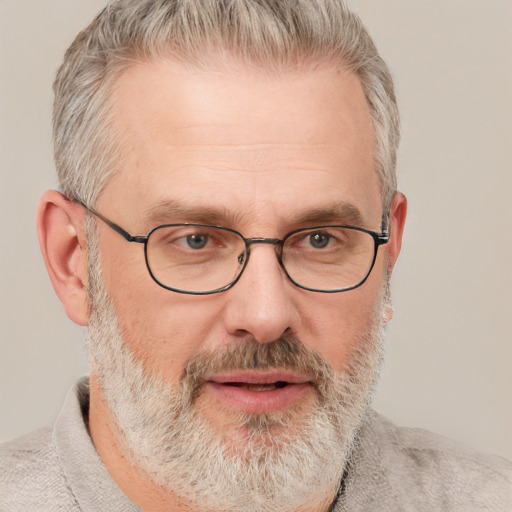 Neutral white middle-aged male with short  gray hair and blue eyes