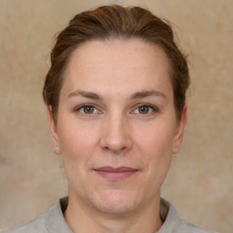 Joyful white adult female with short  brown hair and grey eyes