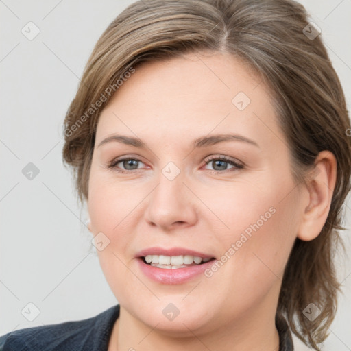 Joyful white young-adult female with medium  brown hair and grey eyes