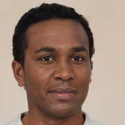 Neutral black young-adult male with short  black hair and brown eyes